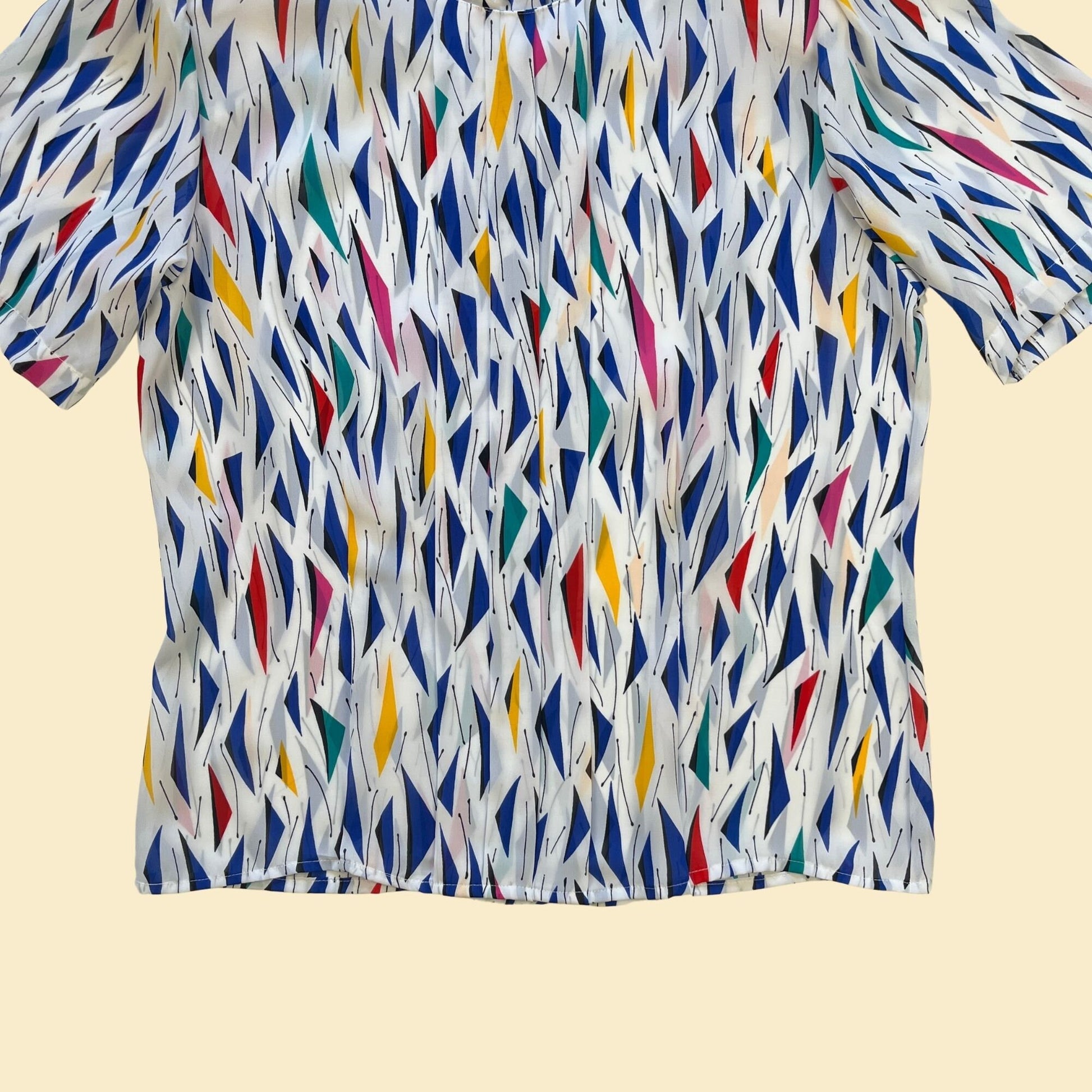 1990s geometric size 12 blouse by SK & Company, vintage 90s white, blue, yellow and red short sleeve sheer blouse