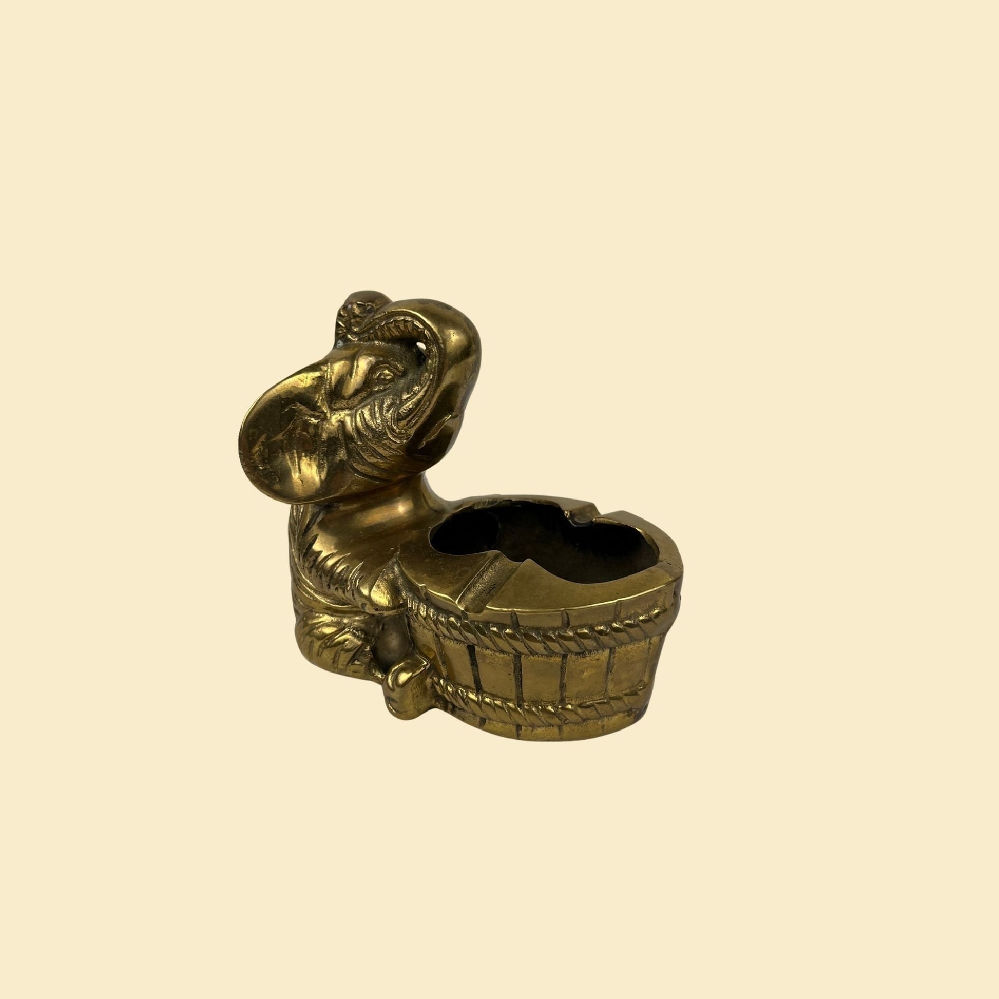 1950s brass elephant ash tray, vintage 50s solid brass ashtray w/ elephant carrying a barrel