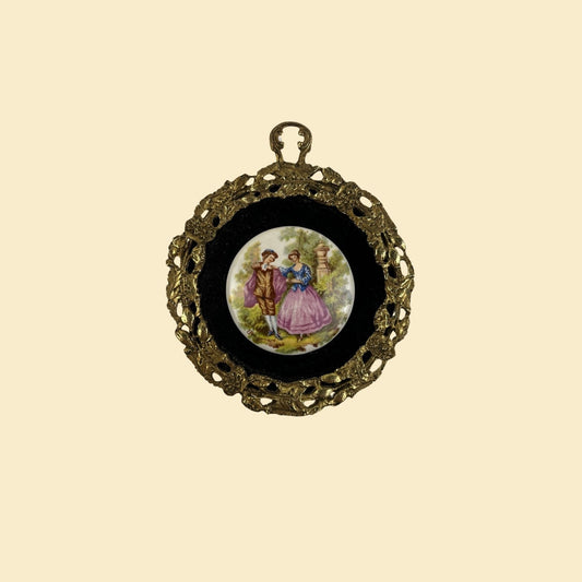 1970s framed porcelain cameo scene, vintage 70s circular brass frame w/ velvet matte-ing and victorian scene