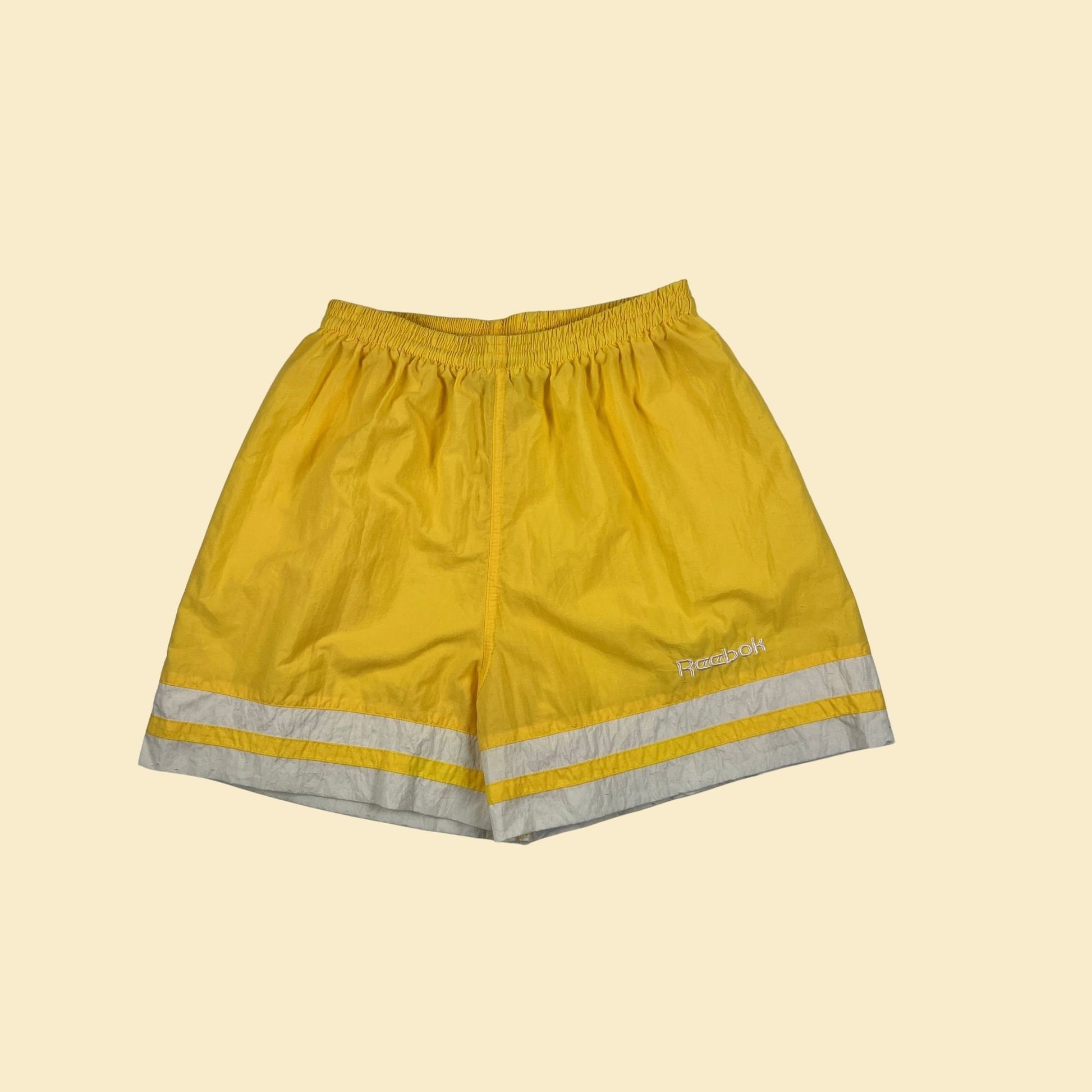 80s/90s Reebok athletic shorts, size M yellow & white women's vintage 1990s workout shorts