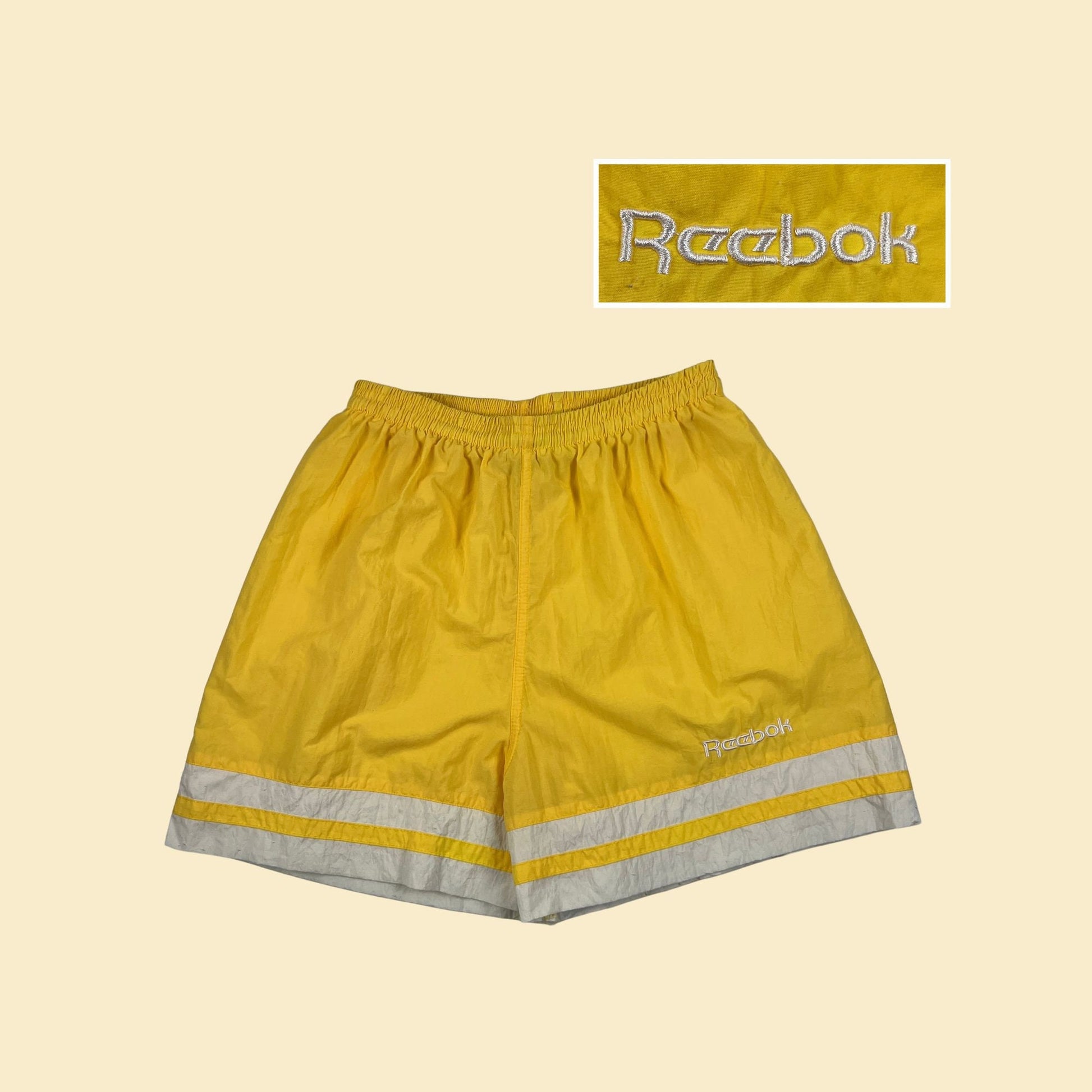 80s/90s Reebok athletic shorts, size M yellow & white women's vintage 1990s workout shorts