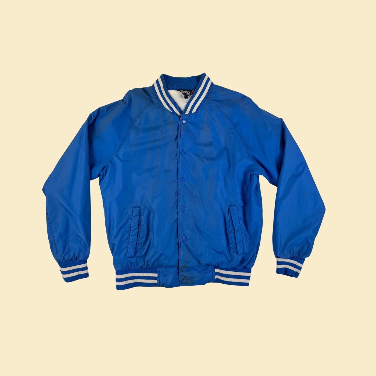 1990s blue bomber windbreaker jacket by Trax,