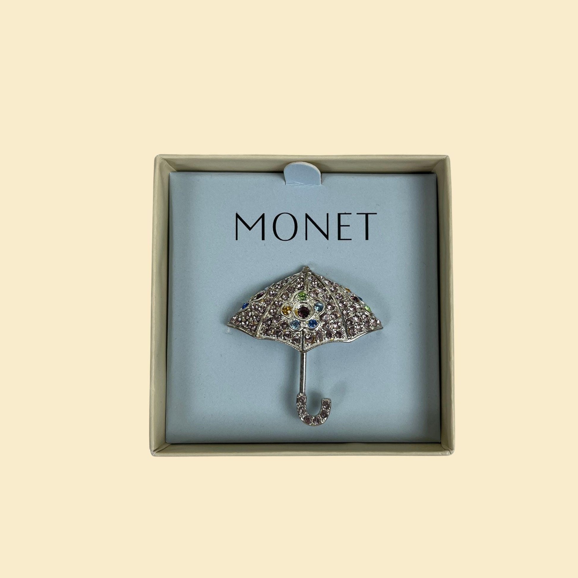 Vintage umbrella brooch by Monet, 1990s purple rhinestone umbrella-shaped pin