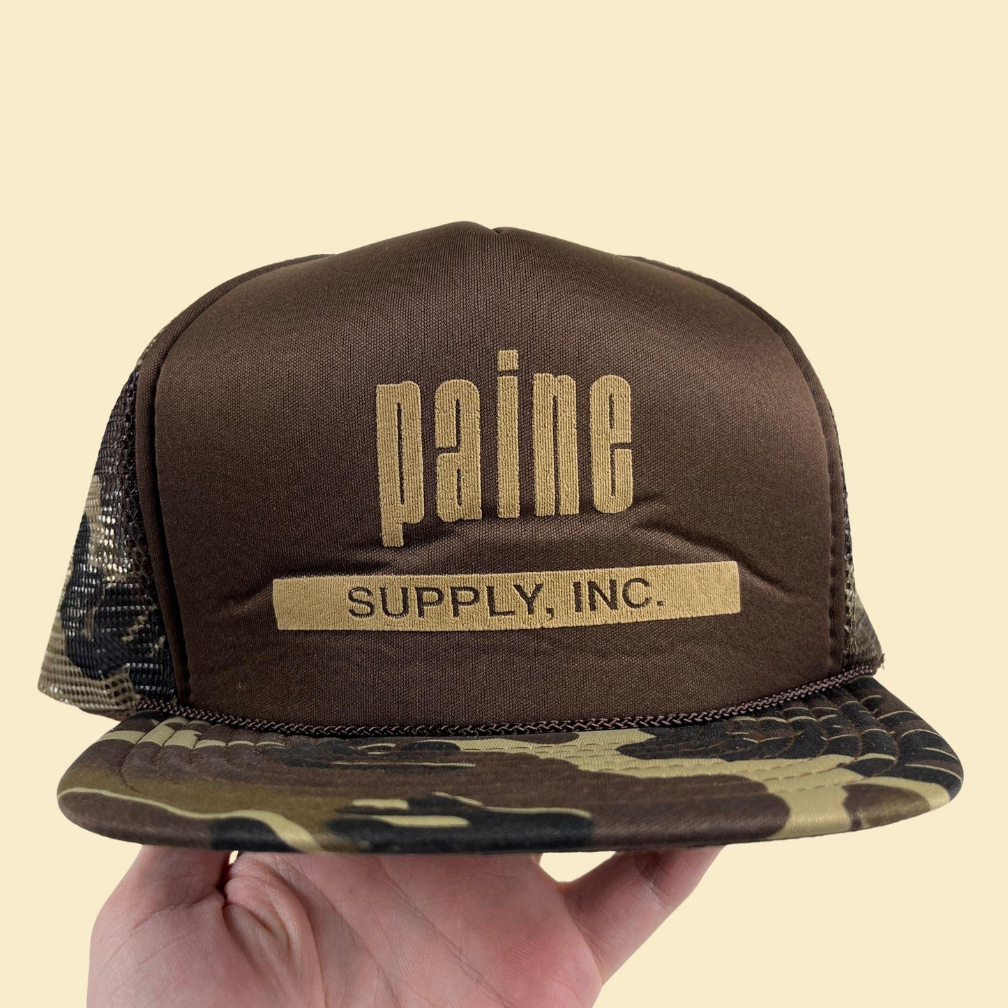 80s camo Paine Supply Inc. snapback hat, vintage San Sun green & brown trucker cap w/ adjustable back