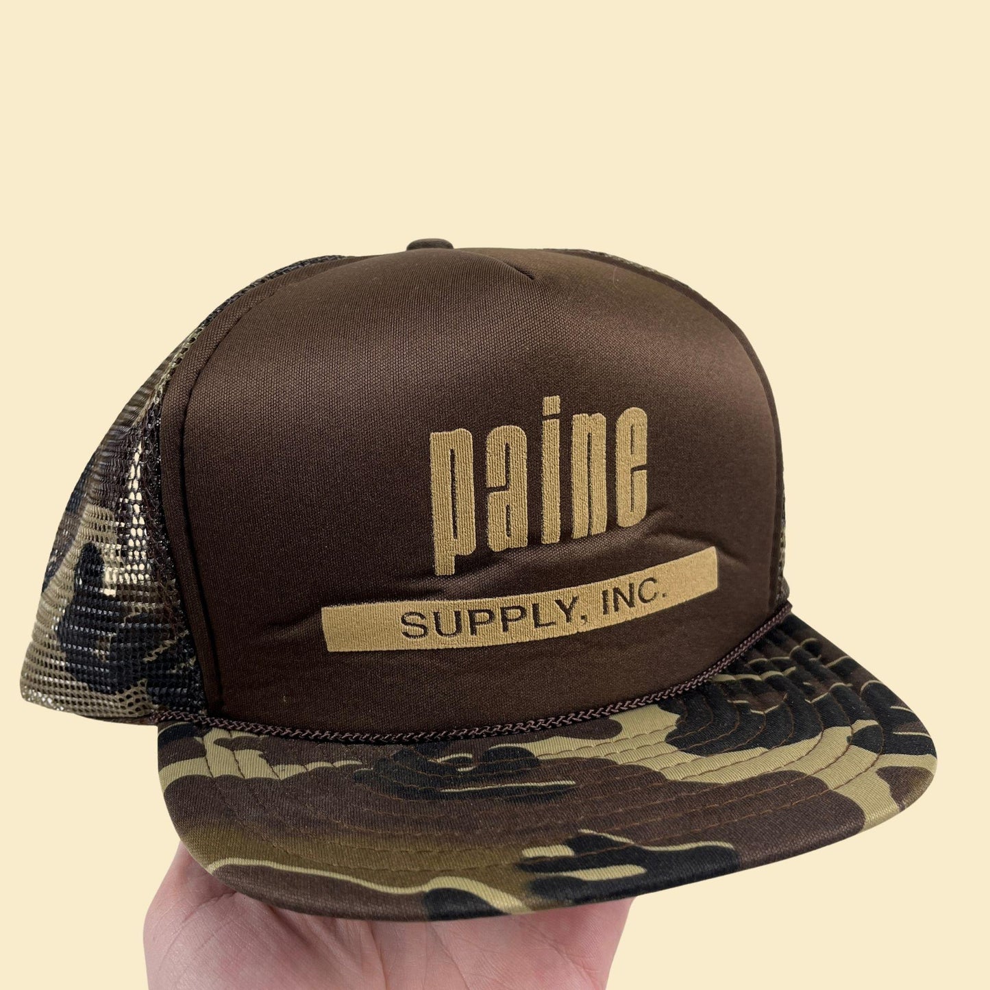 80s camo Paine Supply Inc. snapback hat, vintage San Sun green & brown trucker cap w/ adjustable back