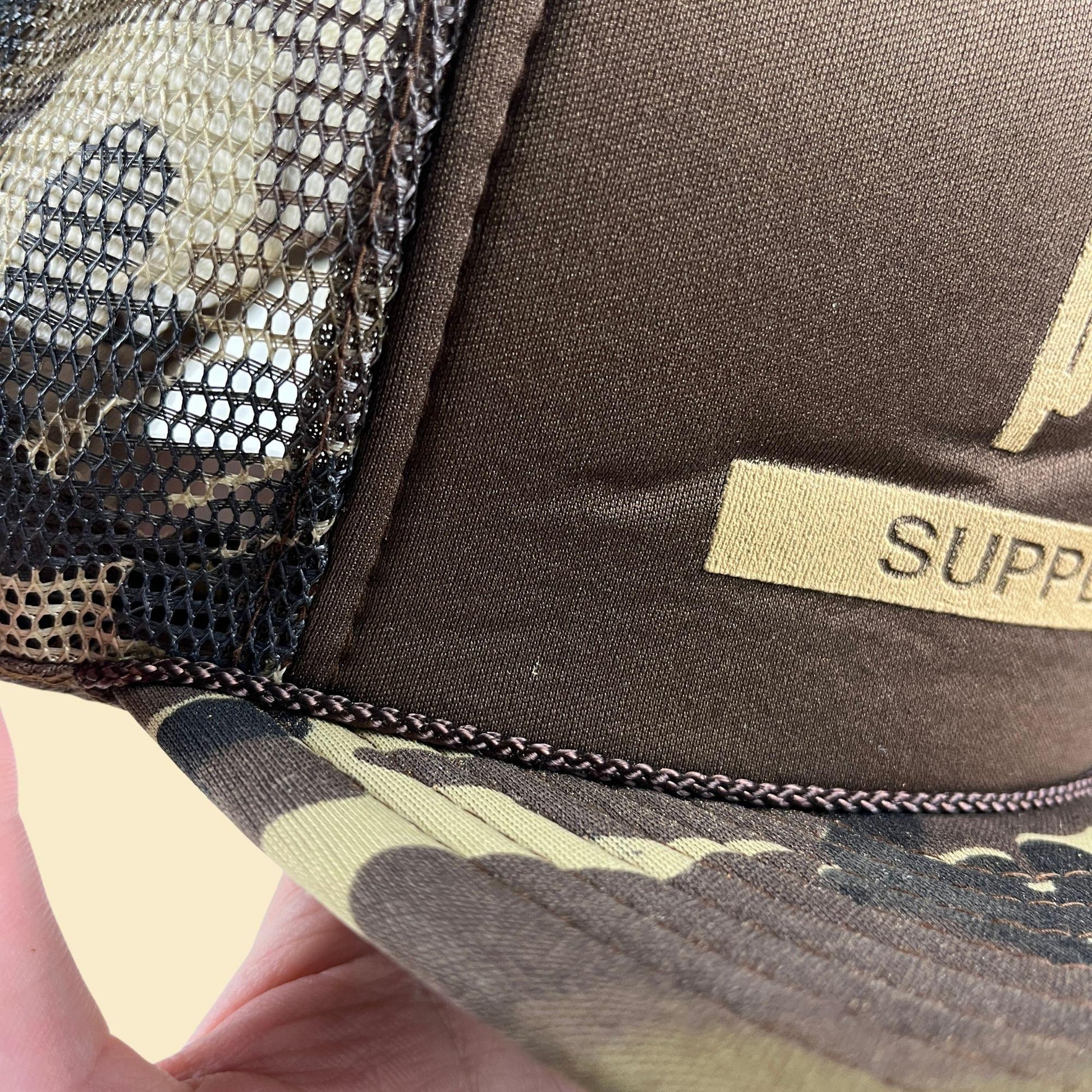 80s camo Paine Supply Inc. snapback hat, vintage San Sun green & brown trucker cap w/ adjustable back