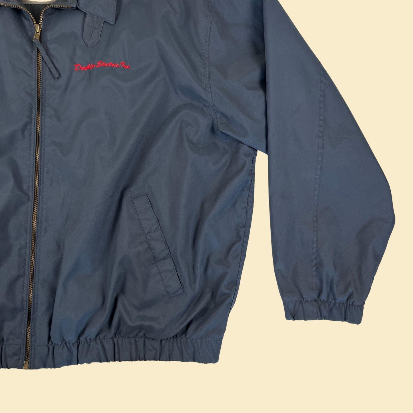 90s/Y2K blue XXL windbreaker jacket by Dunbrooke, vintage Deubler Electric workwear jacket