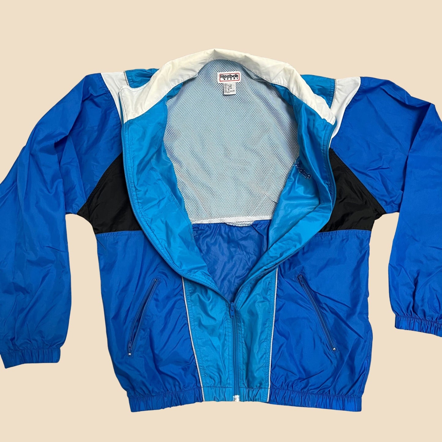 90s medium Reebok patterned windbreaker jacket, 1990s color block blue black and white windbreaker, men's puffy windbreaker