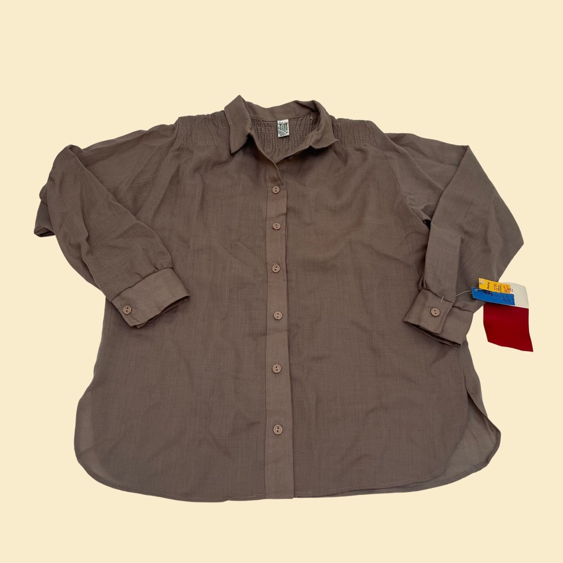 Vintage 1970s brown button down shirt. Has original tags from the 70s.