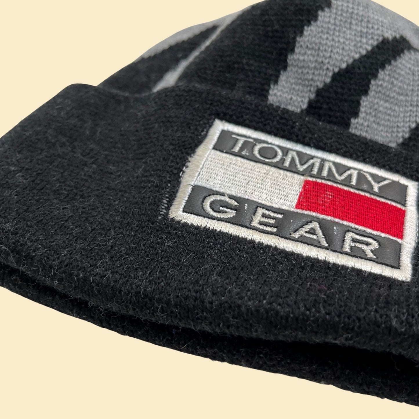 90s Tommy Gear beanie, vintage black and grey Tommy Hilfiger winter hat, 1990s flame patterned skullcap