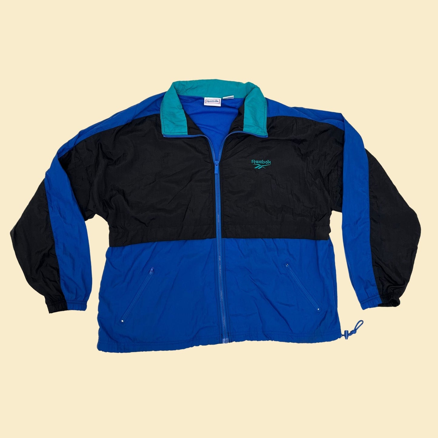 Vintage XL Reebok windbreaker jacket, 1990s color block patterned windbreaker with retractable hood, blue black and teal tracksuit top