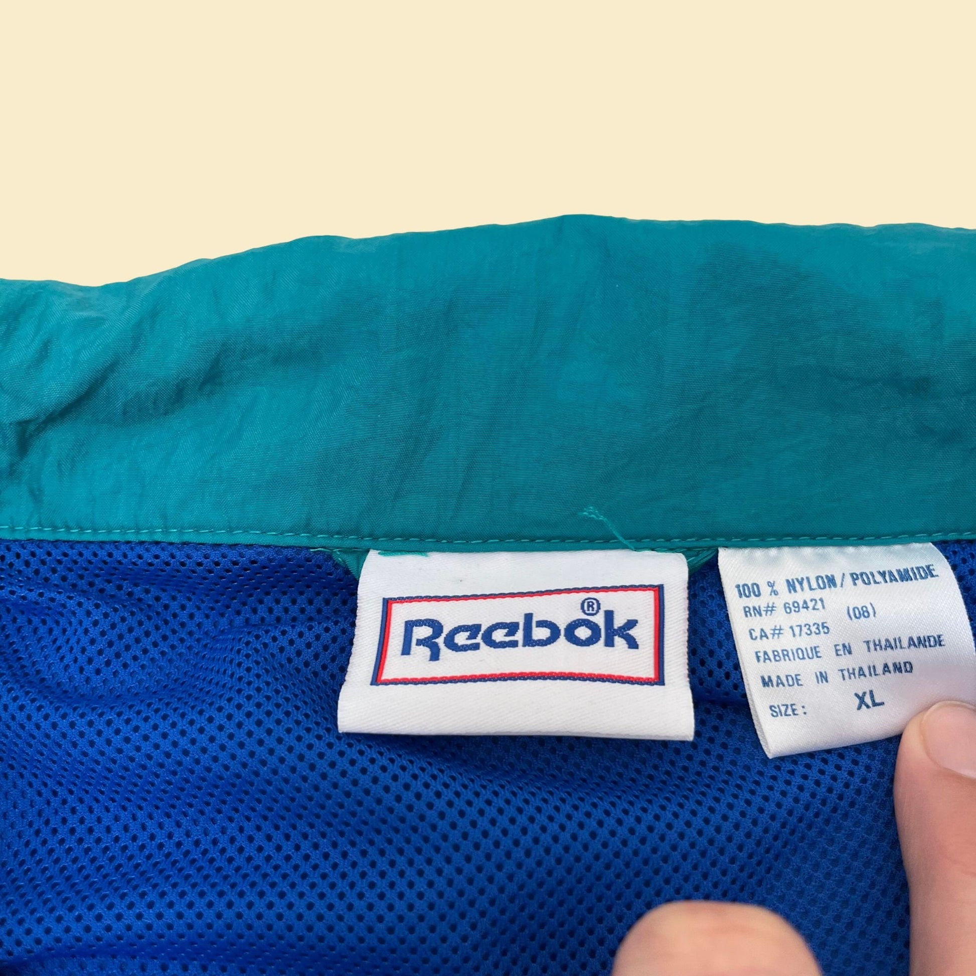 Vintage XL Reebok windbreaker jacket, 1990s color block patterned windbreaker with retractable hood, blue black and teal tracksuit top