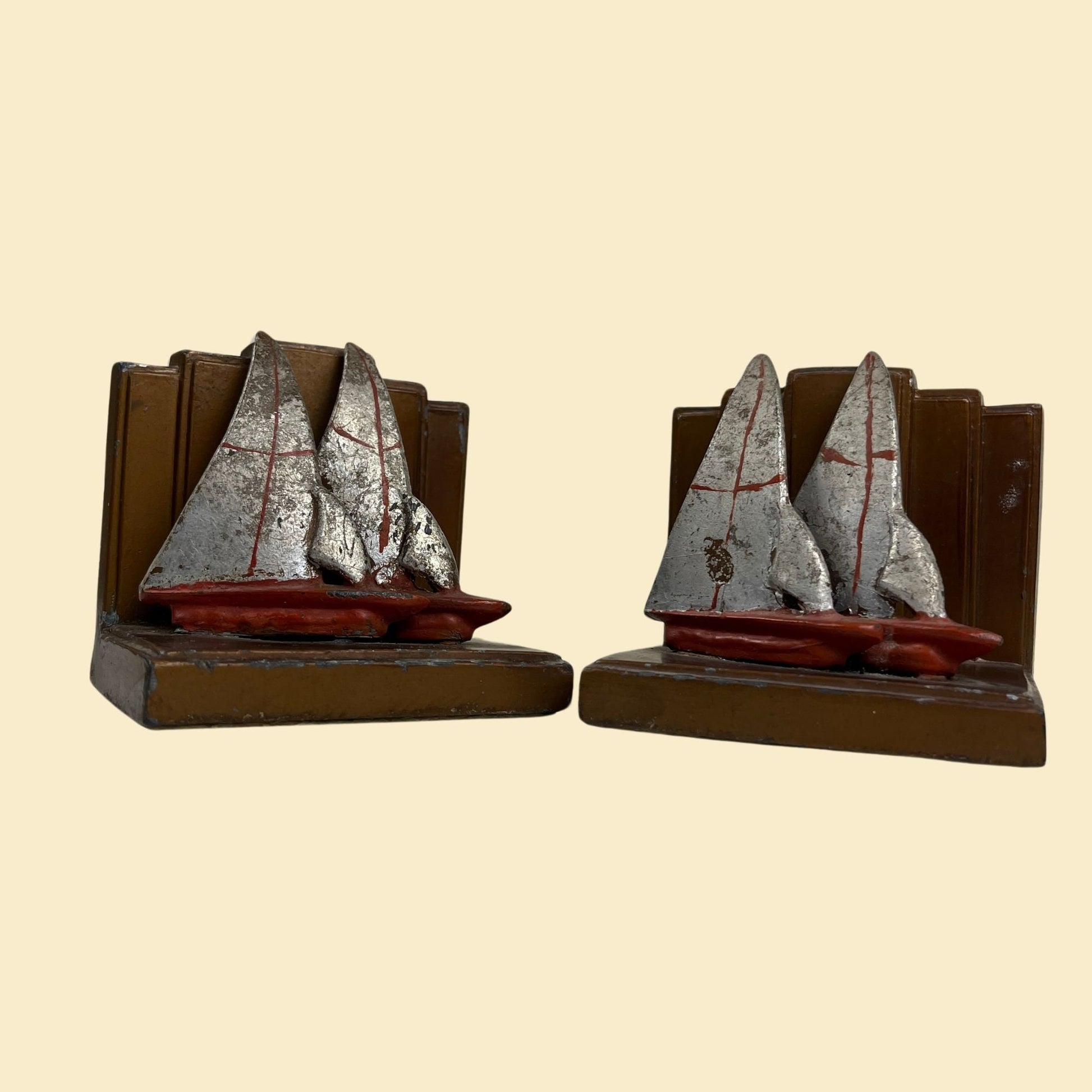 Art deco sailboat bookends, c. 1920s-1930s vintage sailboat heavy book ends, red, grey & copper colored