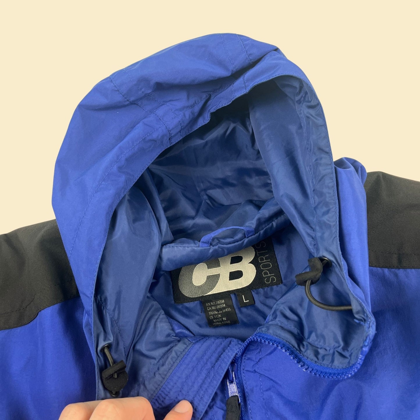 Vintage 90s blue hooded windbreaker by CB Sports, size L 1990s men's colorblock blue & black nylon hoodie with center pocket