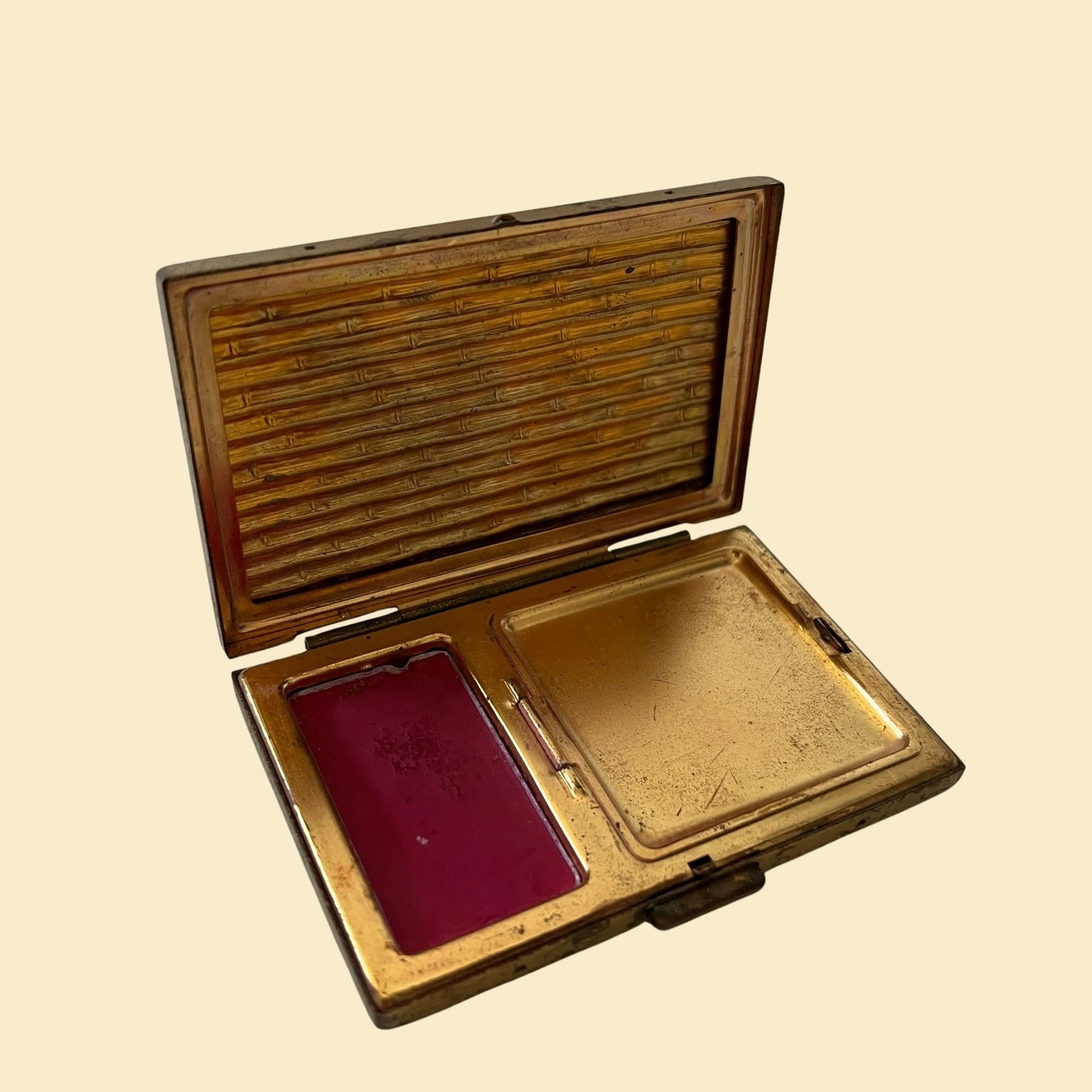 Vintage 1950s Avon cosmetic compact with bamboo pattern, rectangular gold/bronze toned makeup compact